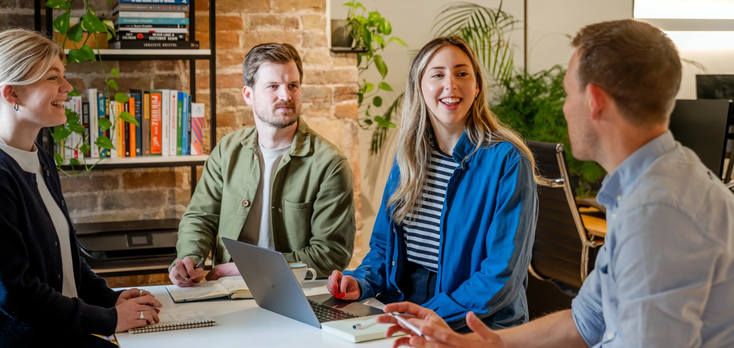 The Luna 9 team brainstorming around a table